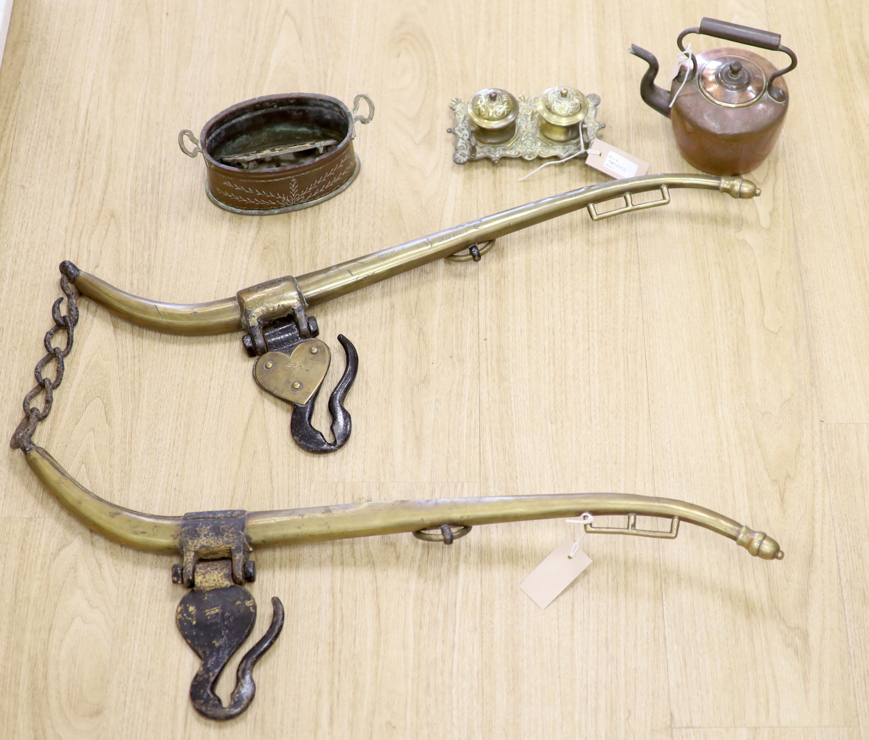 A pair of brass hames, a brass deskstand, a small copper kettle, a small brass and copper jardiniere and a pot stand